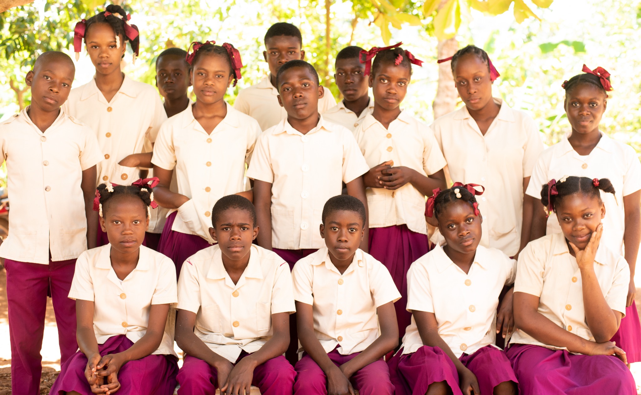 Grade 9 students from HavServe in Southern Haiti pose together outdoors.